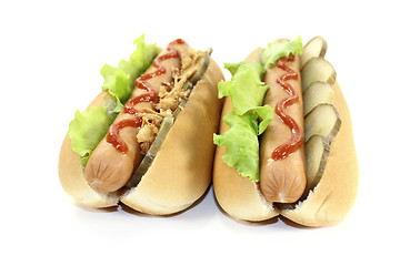 Image showing Hot dogs with pickle and fried onions