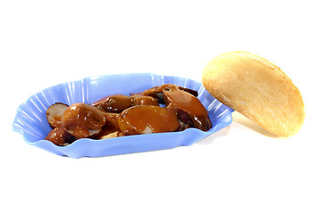 Image showing Currywurst with roll