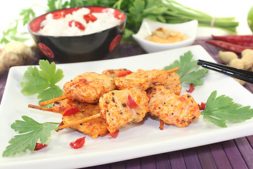 Image showing Asian satay skewers with chilli and peanut sauce