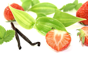 Image showing Vanilla leaves with juicy strawberries