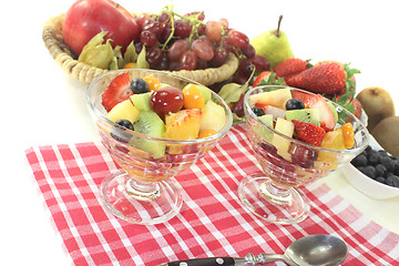 Image showing Fruit salad in a bowl on checkered napkin
