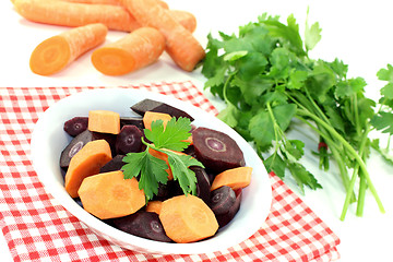 Image showing fresh crisp orange and purple carrots