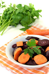 Image showing fresh sliced orange and purple carrots