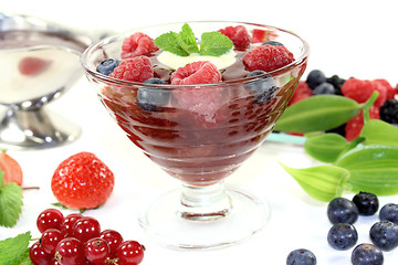 Image showing red fruit jelly with custard and raspberries