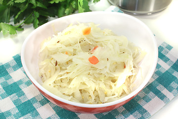 Image showing fresh sourcrout in a red bowl