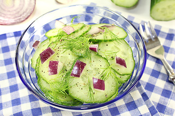 Image showing Cucumber salad with red onions and dill