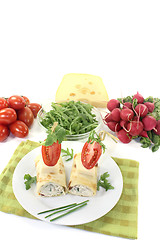 Image showing stuffed cheese crepe rolls with arugula