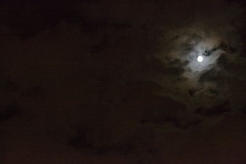 Image showing Moon between clouds