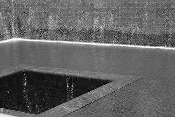 Image showing 9/11 memorial fountain in black and white
