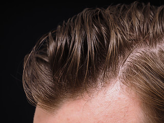 Image showing Hairstyle on male person with brown hair at closeup isolated tow