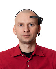 Image showing Portrait of young man with EEG (electroencephalography) headset 