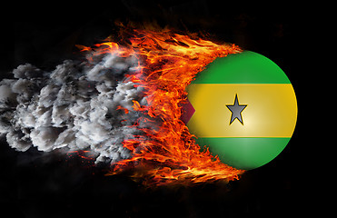 Image showing Flag with a trail of fire and smoke - Sao Tome and Principe