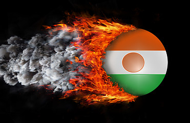 Image showing Flag with a trail of fire and smoke - Niger