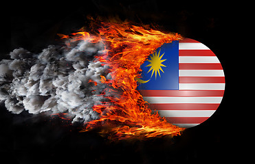 Image showing Flag with a trail of fire and smoke - Malaysia