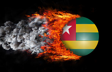 Image showing Flag with a trail of fire and smoke - Togo