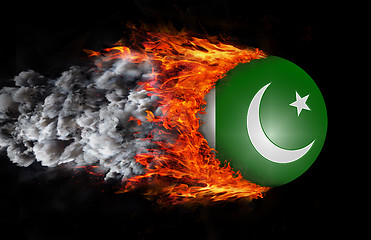 Image showing Flag with a trail of fire and smoke - Pakistan