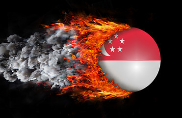 Image showing Flag with a trail of fire and smoke - Singapore