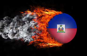 Image showing Flag with a trail of fire and smoke - Haiti