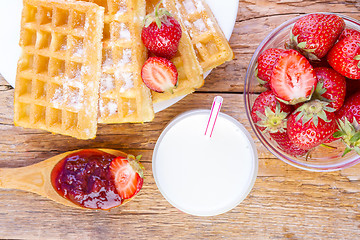 Image showing homemade waffles with strawberries maple syrup