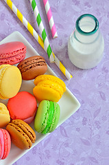 Image showing color macaroons and milk 