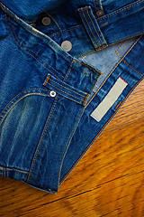 Image showing old unbuttoned jeans