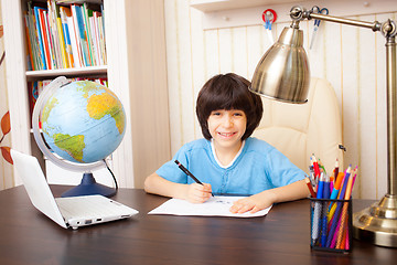 Image showing schoolboy doing homework