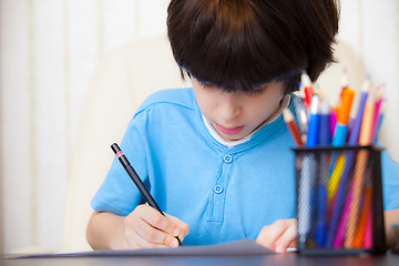 Image showing Boy doing homework