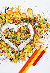 Image showing heart, three pencils and varicolored wooden shavings