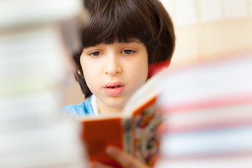 Image showing child reading a book