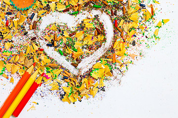 Image showing heart, multicolored pencils and varicolored wooden shavings