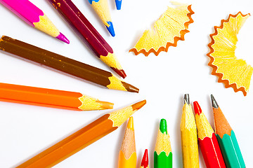 Image showing colored pencils and shavings on white background