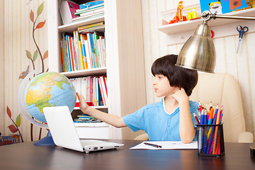 Image showing studying geography, boy and globe