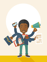 Image showing Young but happy african employee doing multitasking office tasks.