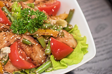 Image showing Warm salad with chicken