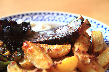 Image showing grilled ribs and potatoes 