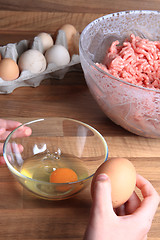 Image showing crashing eggs for preparing food