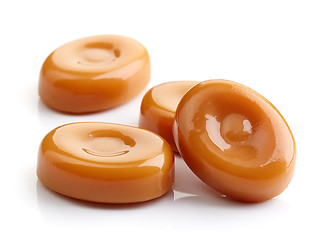 Image showing caramel candies isolated on white background