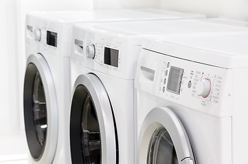 Image showing line of laundry machines