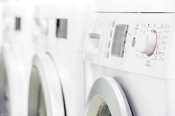 Image showing line of laundry machines
