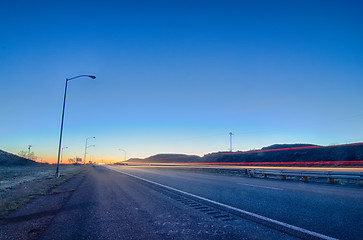 Image showing early orning travel on highway before sunrise