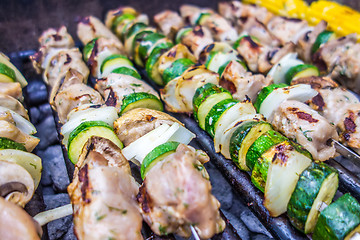 Image showing steak shishkabob skewers with vegitables cooking on flaming gril