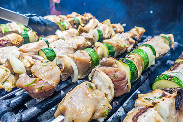 Image showing steak shishkabob skewers with vegitables cooking on flaming gril