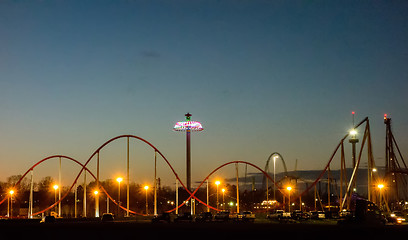 Image showing sunset over an amusement park in a distance