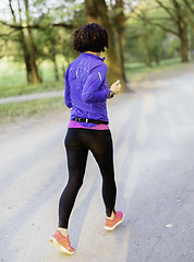 Image showing Young female jogger