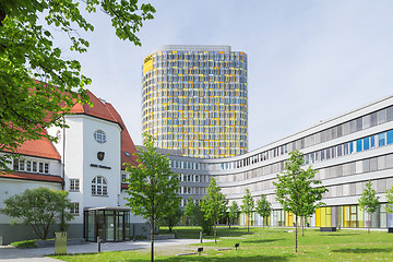 Image showing Old small clubhouse and the new ADAC Headquarters tower