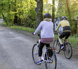 Image showing Young women on bikes in park