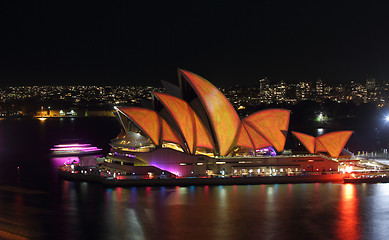 Image showing Sydney Opera House in burnt orange and yellow Vivid Sydney