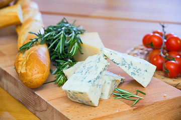 Image showing Cheese and bread on the wooden board