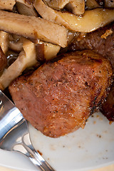 Image showing venison deer game filet and wild mushrooms