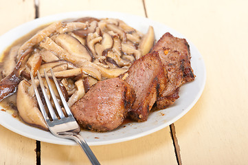 Image showing venison deer game filet and wild mushrooms